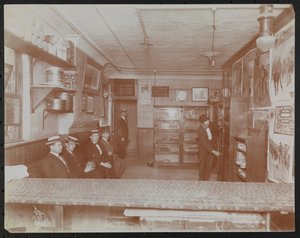 Empire Film Co (Possibly at Broadway and 55th Street) with Movie Posters on Wall and Customers Waiting by Company Byron