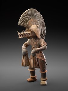 Dancer with crocodile helmet, 300 BC-300 AD