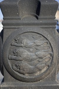 Three Lions Symbol Carved in a Stone Column in the City Hall Square
