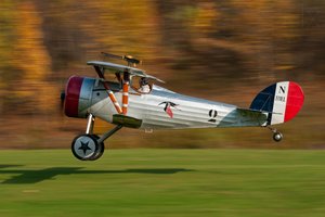 Vintage Biplane Taking Off by Darek Siusta