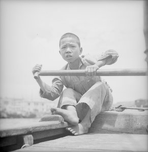 A sampan boy at Hong Kong