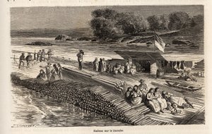 A wooden raft on the Danube for the transport of goods and people. Engraving in Le tour du monde, edited by Edouard Charton by Dieudonne Auguste Lancelot