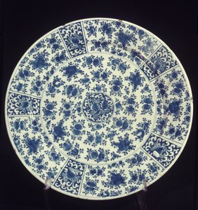 Plate with blue rose pattern by Dutch School