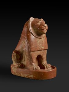 Statuette of a Lion seated on a plinth, from the temple precinct at Hierakonpolis, Egyptian, late Protodynastic, end of the Old Kingdom, c.2700-2200 BC