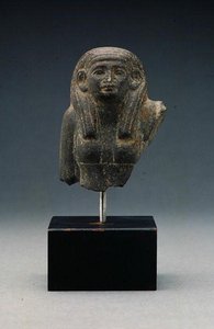 Head and shoulders of a woman from a group statue, probably a funerary dyad, Middle Kingdom