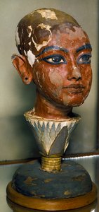 Egyptian Antiquities: Portrait of the Young Pharaoh Tutankhamun Supported by a Lotus Leaf. Painted Wood Carving. From the Treasure of Tutankhamun by Egyptian 18th Dynasty