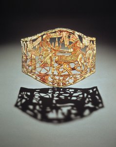 Openwork plaque or buckle showing the kings triumphal return with prisoners, from the Tomb of Tutankhamun, New Kingdom