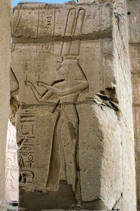 Egyptian antiquity: detail of reliefs depicting the goddess Hathor holding sistrums in her hands, Funeral Temple dedicated to Pharaoh Ramses II, site of Ramasseum in Luxor, Egypt by Egyptian 19th Dynasty