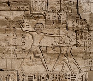 Egyptian antiquity: detail of reliefs celebrating the victories of the Pharaoh over the peoples of the sea. Funeral Temple of Ramses III (1187-1156 BC). Luxor, Medinet Habu, Egypt by Egyptian 20th Dynasty