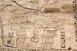 Detail of the reliefs of the first pylon representing the capture of fighters belonging to the peoples of the sea, enemies of Ramses III. Funeral Temple of Ramses III, Luxor, Medinet Habou, Egypt by Egyptian 20th Dynasty