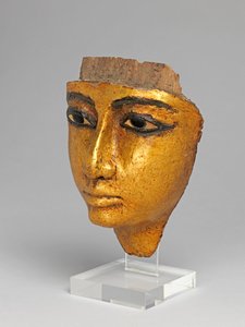 Face from a coffin, with eyes and eyebrows inlaid, gilded