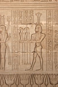 Egyptian antiquity: representation of a man bringing offerings as homage to the goddess, Temple of Hathor, Denderah, Egypt