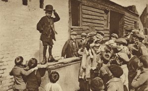 A Budding Humorist of the East End Doing a Charlie Chaplin Impression