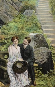 Couple seated on a stone bench near some steps by English Photographer