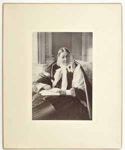 Florence Nightingale, seated on a couch in the Blue Room at Claydon House, 1891