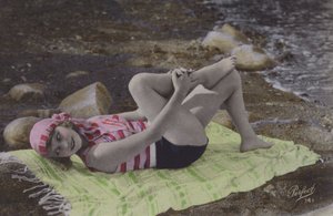 Girl Lying on Towel on Beach by English Photographer