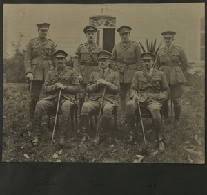 Group portrait of seven men in military uniform, 1914-18 by English Photographer