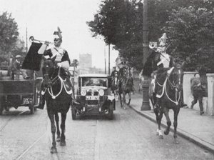 Mounted Heralds of Arms Preceding an Official Car, London by English Photographer