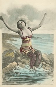 Pretty girl in unusual striped bathing costume with leggings