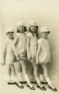 Row of four girls pointing their toes