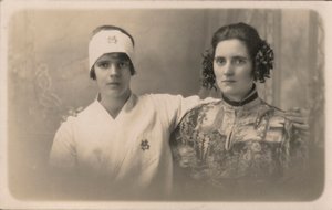 Two young women, with arms around each other
