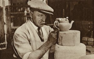 Worker producing a teapot at the Royal Doulton works, Stoke-on-Trent, Staffordshire