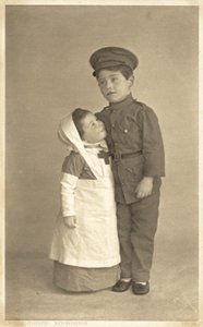 Young girl and boy in WW1 role playing by English Photographer