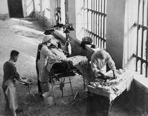 A Field Surgery Unit operating in an Italian prison under fire during World War Two, from a collection of 650 photographs compiled by the Command Association