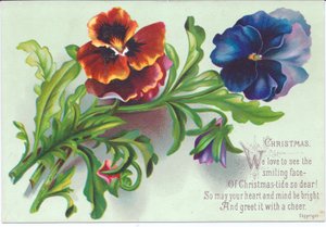 A Victorian Christmas card of a spray on pansies