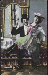 A well-dressed couple laughing by English School