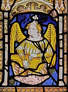 The East window depicting a musician angel with zither by English School