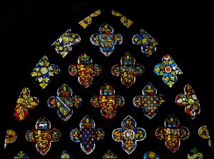 The East window tracery lights heraldic glass showing the local leading families