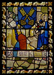 The east window depicting St John, St Peter at the Gate, shield with a symbol of St Peter by English School
