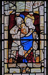 Window Ew depicting St Anne, Joachim, the Virgin Mary and the Christ Child
