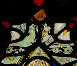 Window depicting dragons by English School