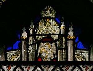 Window depicting a canopy with a musical angel by English School