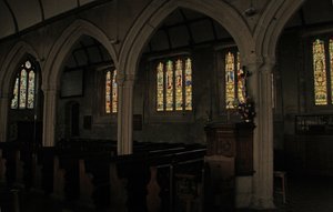 Window depicting a view of the north aisle with fifteenth century stained glass windows by English School