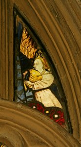 Window depicting a musician angel with bagpipes