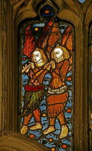 Window depicting musician angels with oboes
