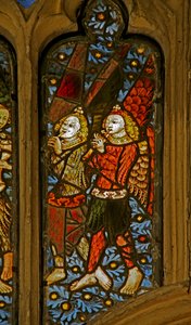 Window depicting musician angels with pipes