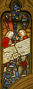 Window depicting the angelic choir with musical score
