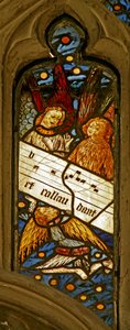 Window depicting the angelic choir with musical score