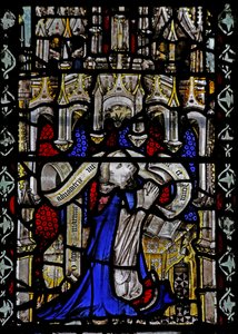 Window n4 depicting a cleric with scroll