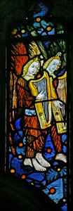 Window depicting musician angels with harps