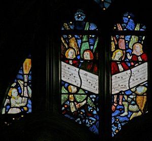 Window depicting the angelic choir singing; angel censing by English School