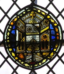 Window s4 depicting a shield with architectural detail by English School