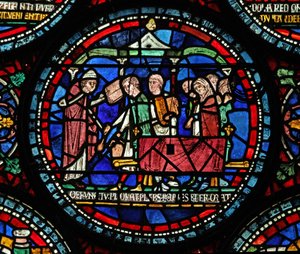 Window 6 depicting a scene from a St Thomas Becket Miracle window: Gilbert de Brun funeral