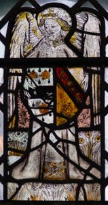Window w5 depicting an angel with a shield of arms by English School