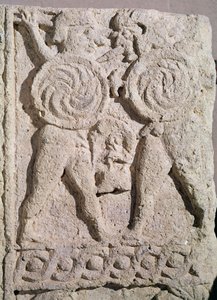 Detail of a tombstone with two warriors by Etruscan