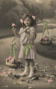 Portrait of a young girl carrying baskets of flowers